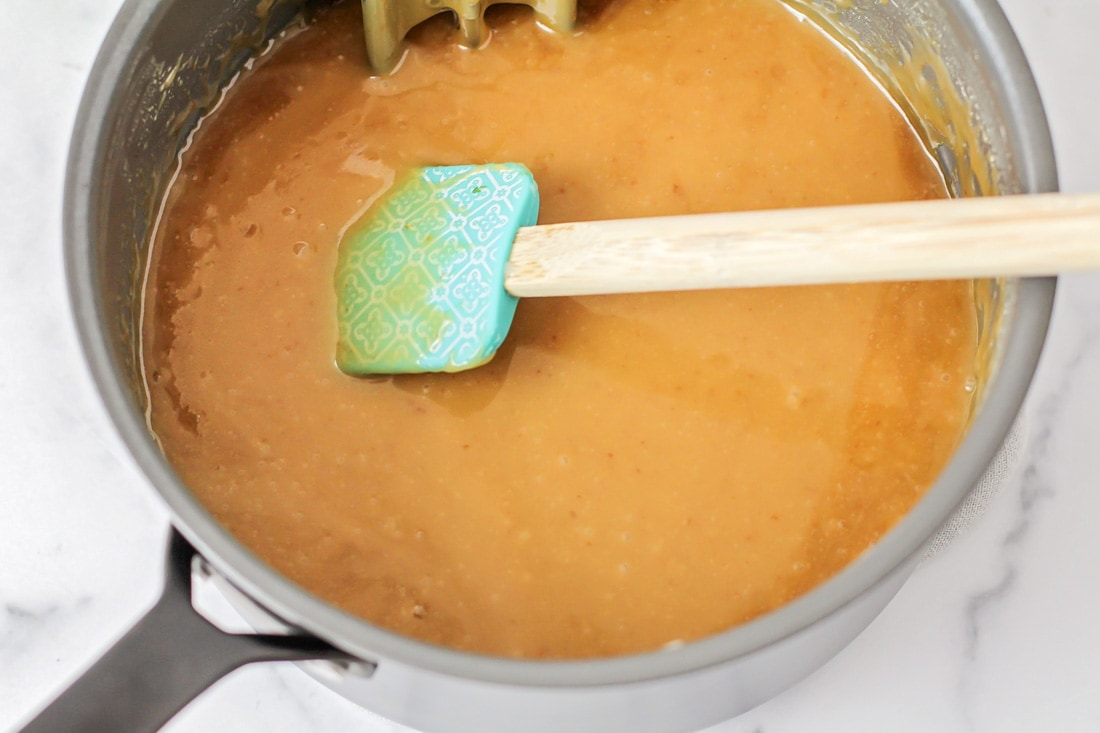 Homemade caramel cooking in a pot.