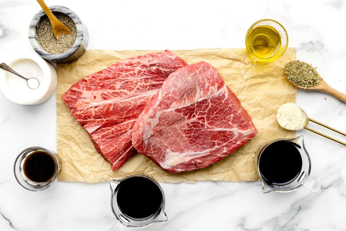 Uncooked steak and ingredients used to marinate it.