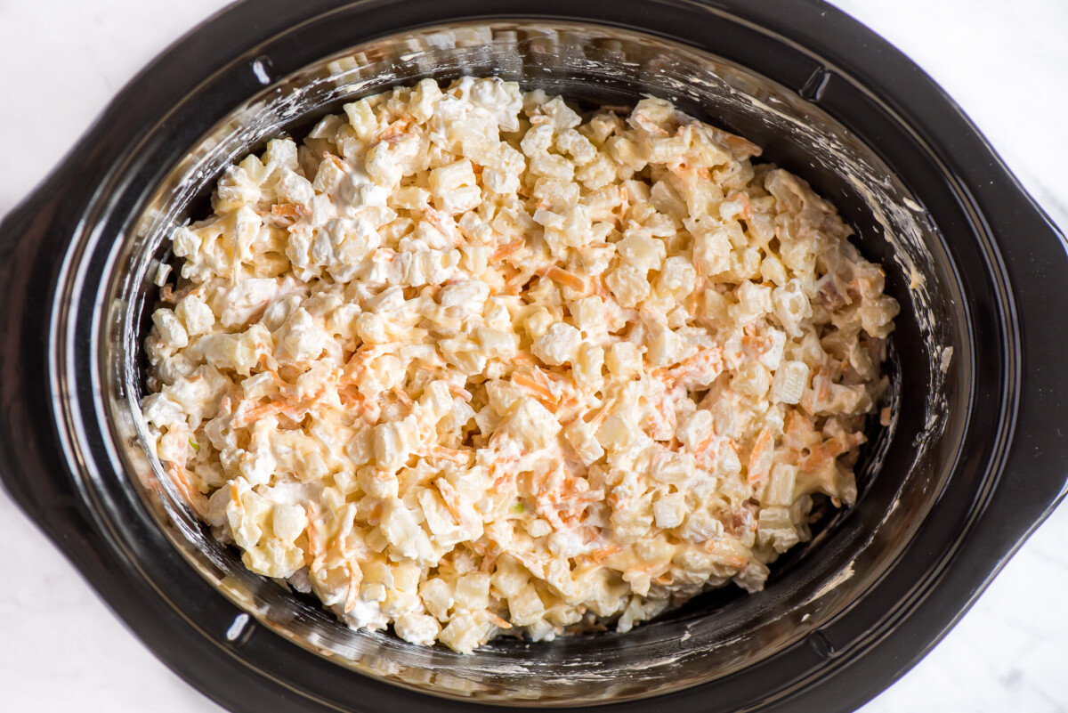 Crockpot cheesy potatoes are the perfect, easy side dish for your next meal or holiday gathering. Just dump, cook, and enjoy!! Combining hash browns, sour cream, condensed soup, and cheese in a crock pot.