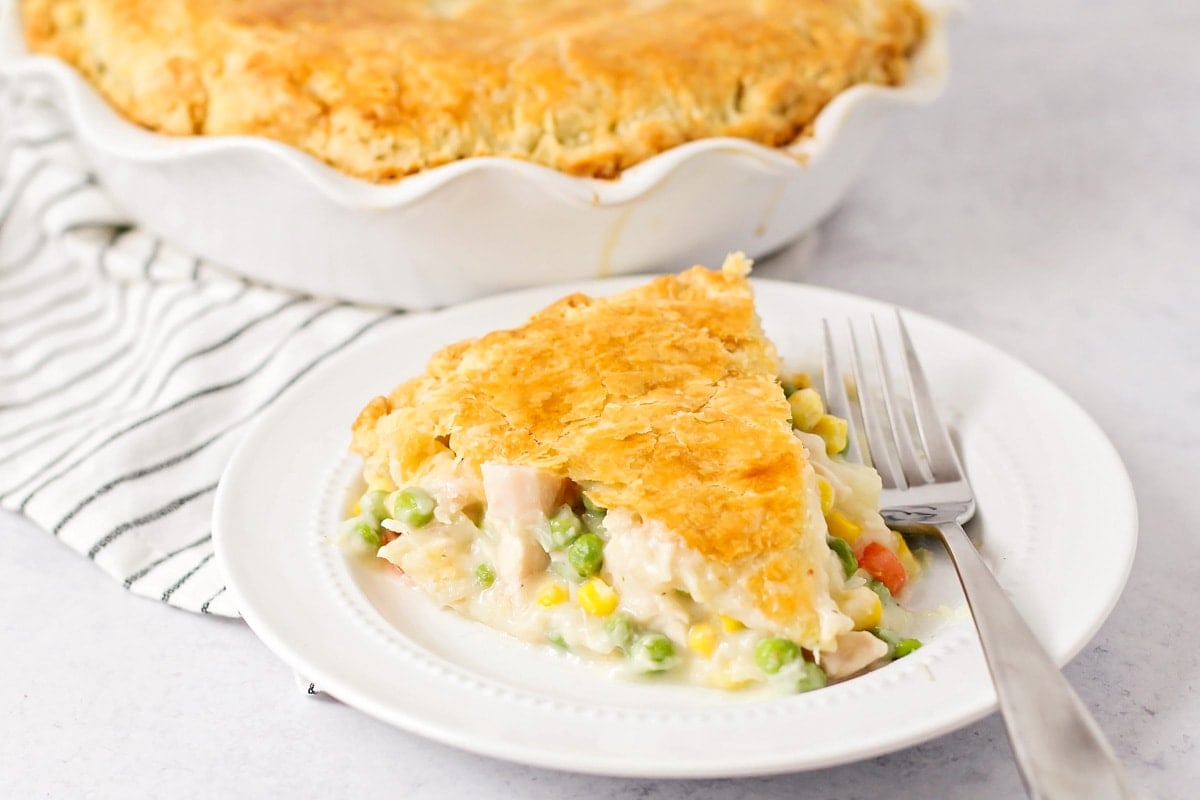 A slice of chicken pot pie recipe served on a white plate.