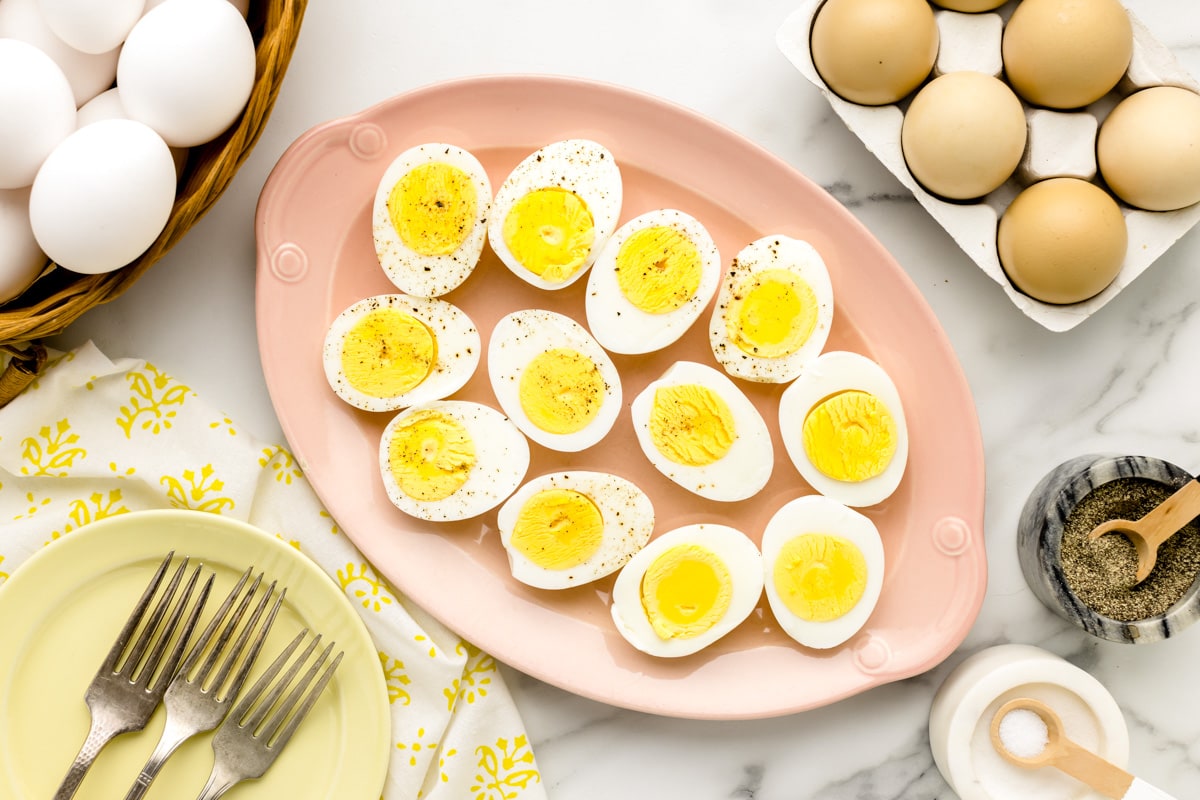 Easy peel hard boiled eggs sliced and placed on serving platter.