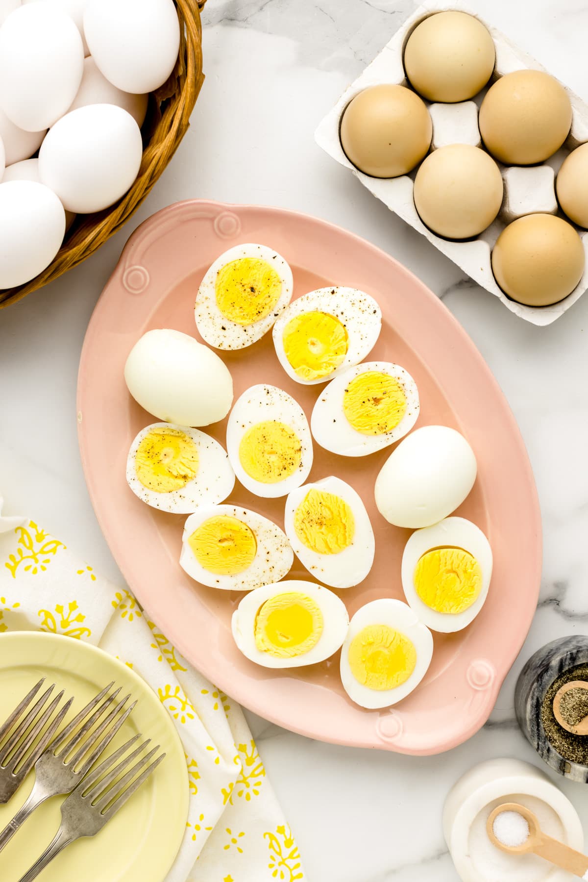Easy peel hard boiled eggs placed on coral serving platter.
