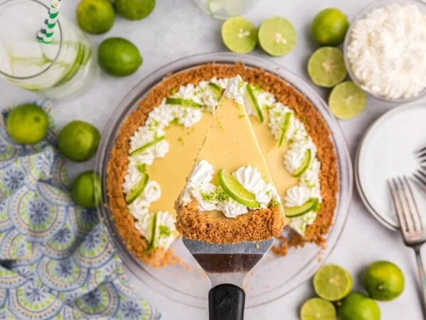 Pulling a slice of key lime pie from the pan.