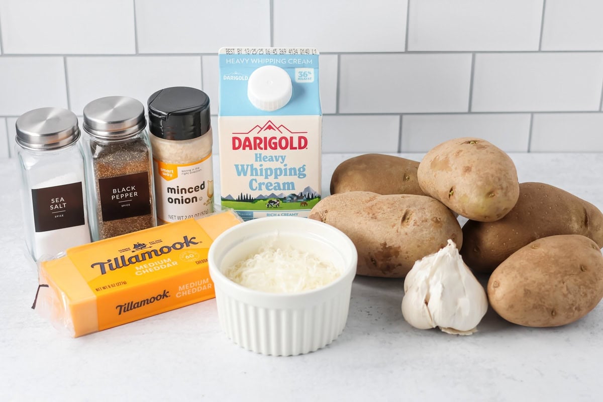 Crockpot scalloped potatoes ingredients on countertop.