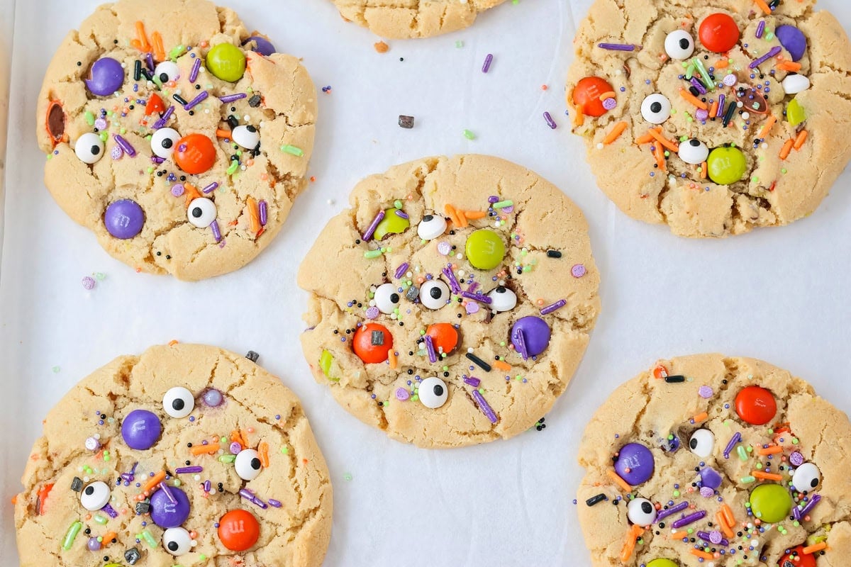 Halloween cookies with candy, sprinkles and candy eyes.