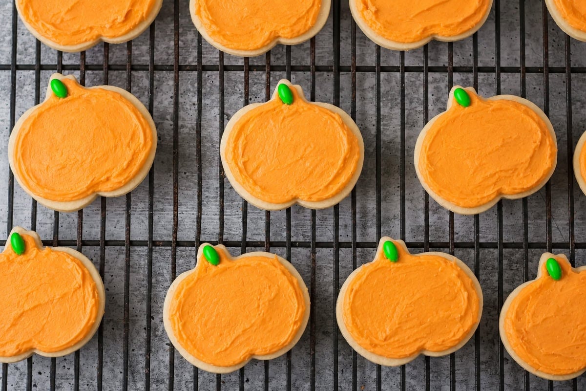 Halloween sugar cookies on cookie rack.