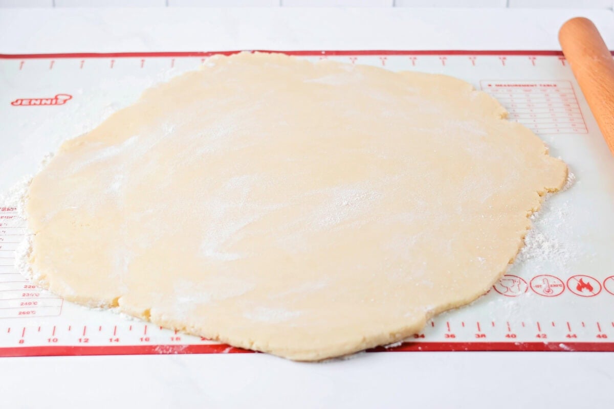 Sugar cookie dough rolled out on Silpat.