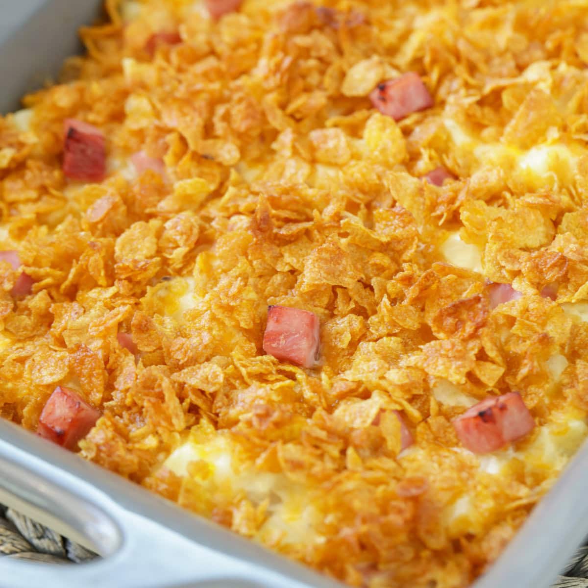 Close up of ham and potato casserole in a baking dish.