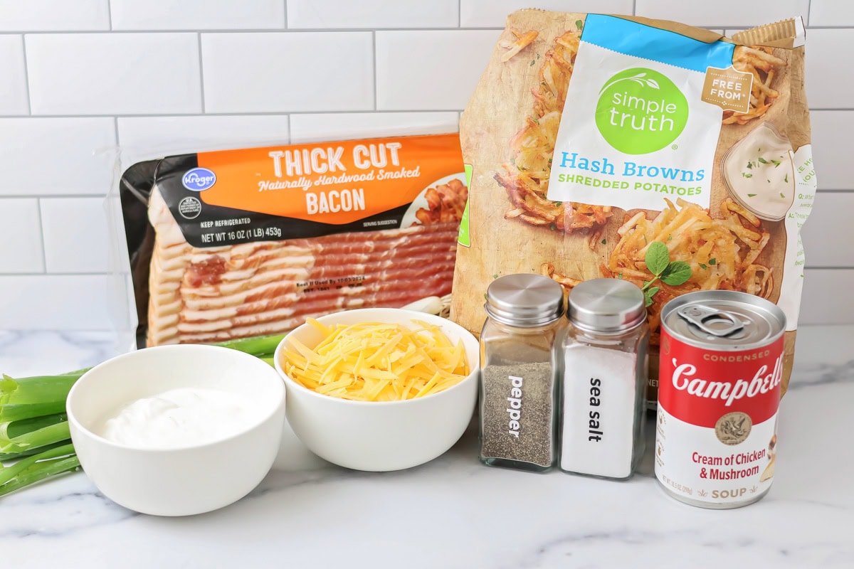 Hashbrown casserole ingredients on white countertop.