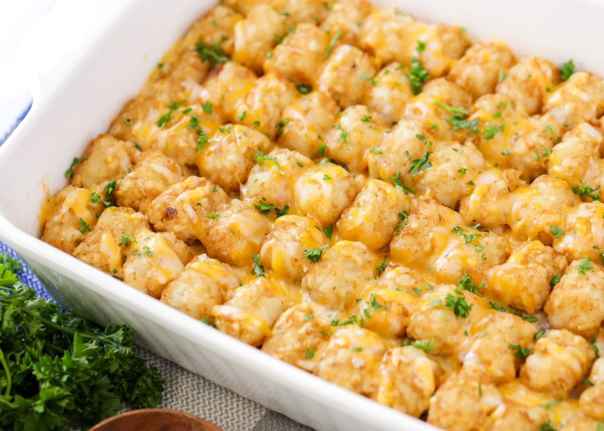 Close up of tater tot casserole covered in melted cheese.