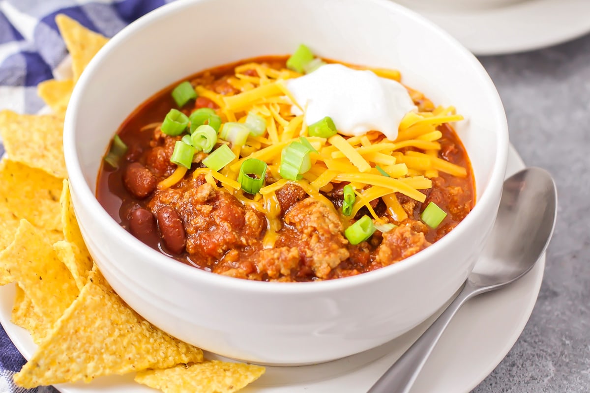 Turkey chili topped with cheese, sour cream and green onions.