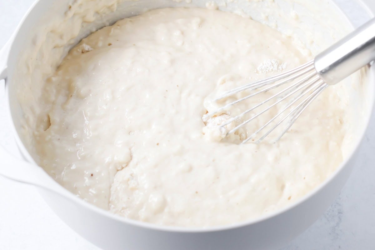 Mixing buttermilk pancake batter in a bowl.