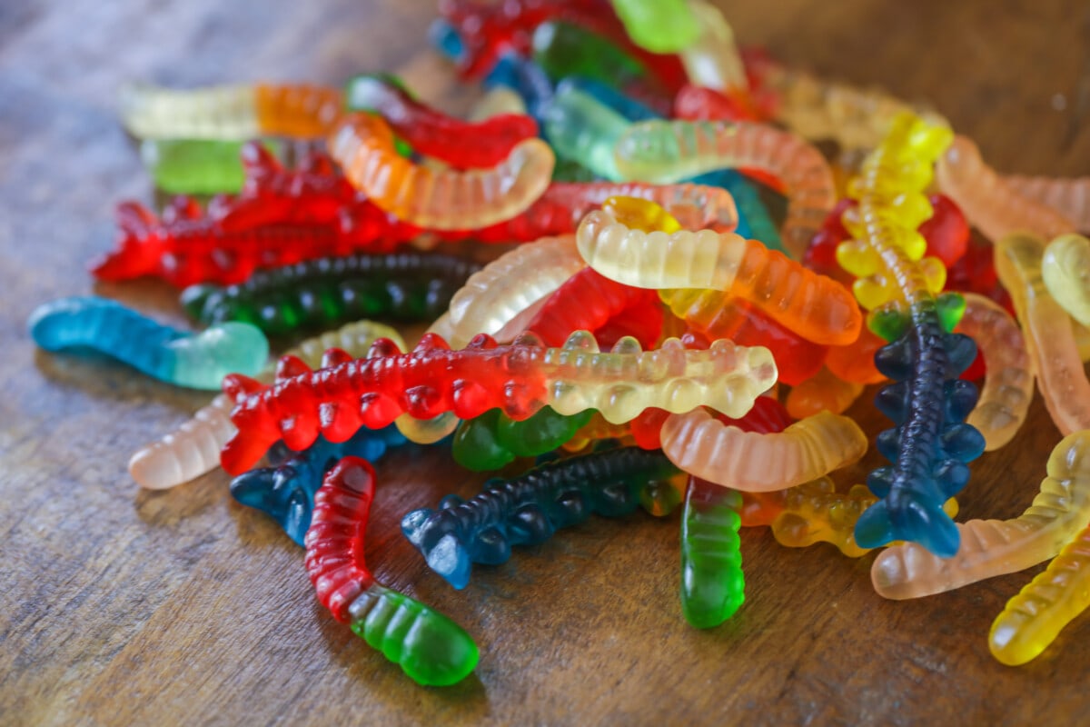 Gummy worms on table.