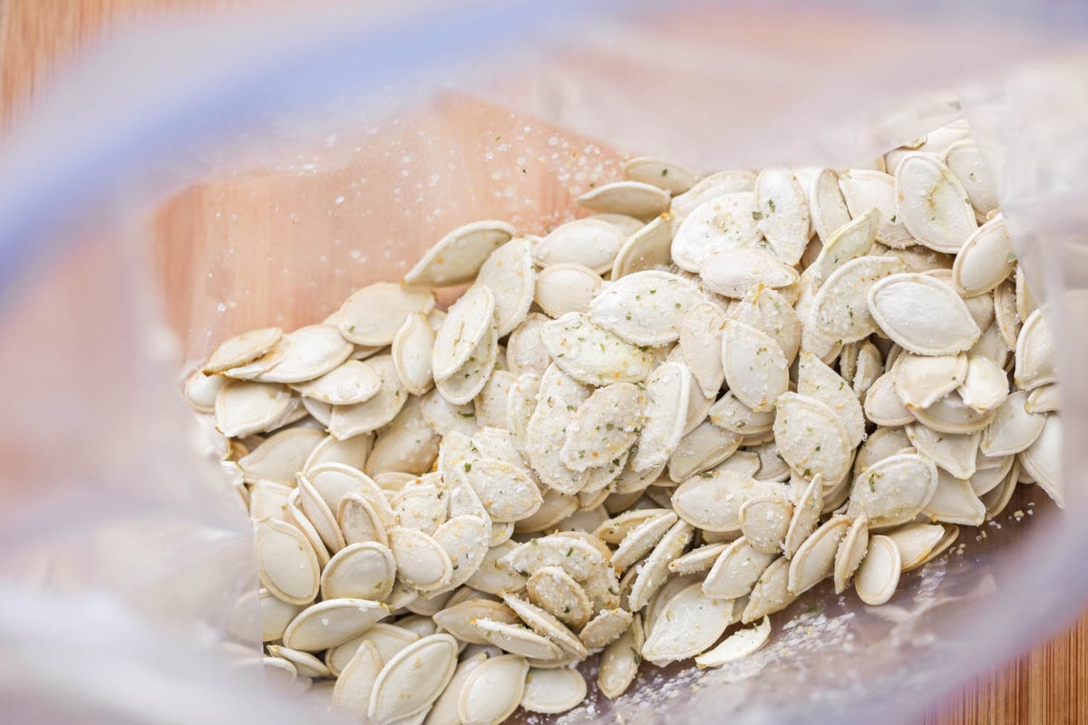 Pumpkin seeds coated in butter and garlic salt.