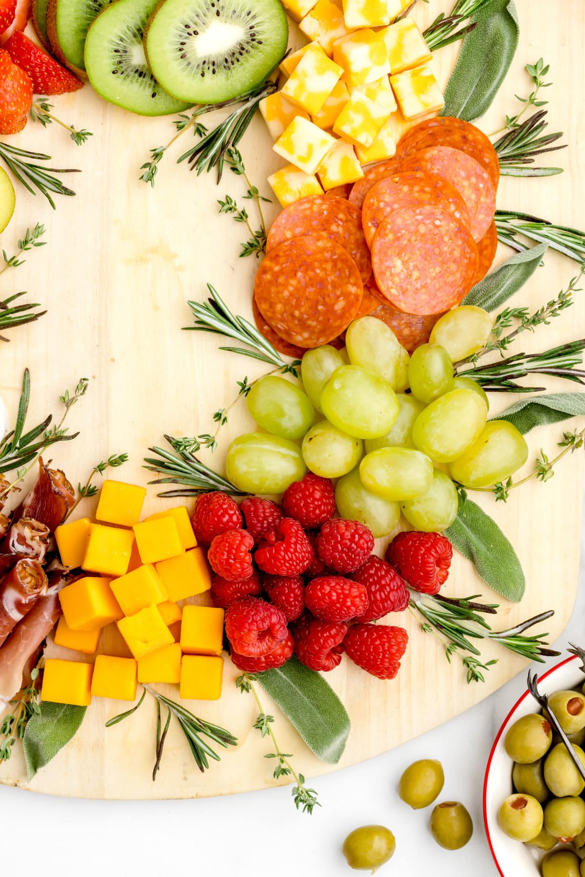 Close up of food on Christmas themed charcuterie board.