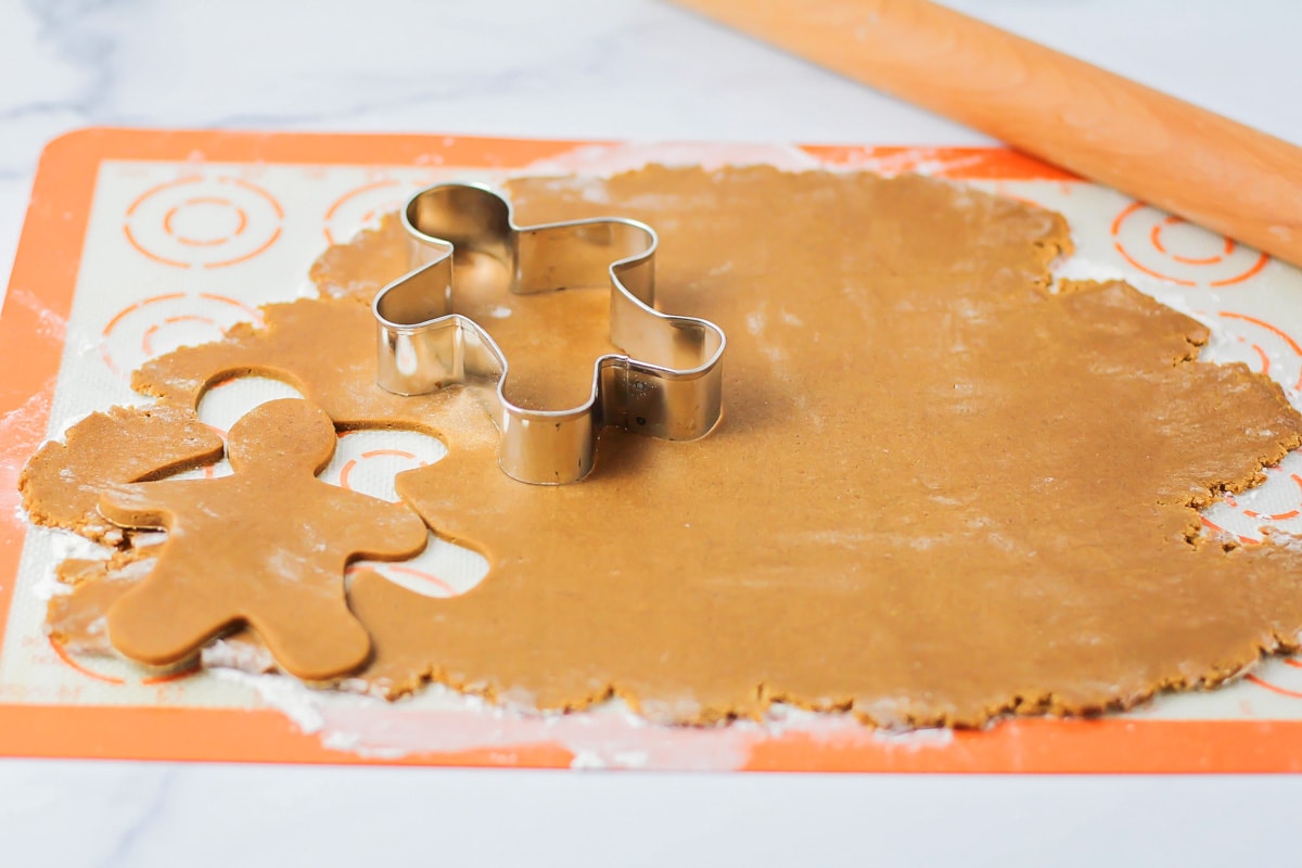 Stamping out gingerbread shaped from cookie dough.