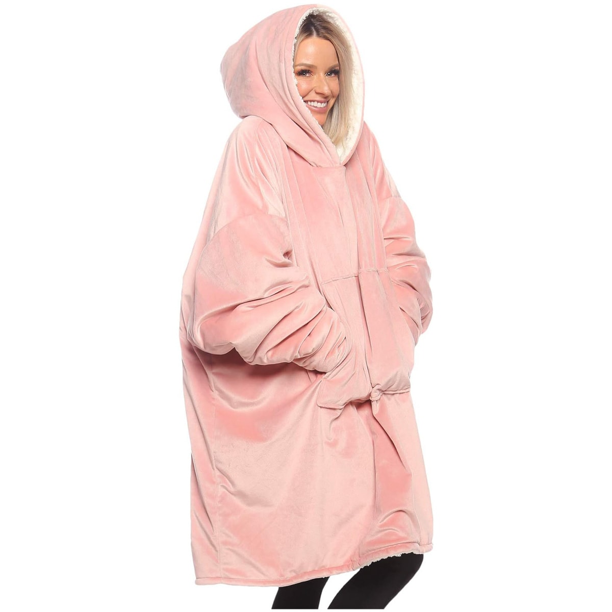 Woman wearing a pink wearable blanket.