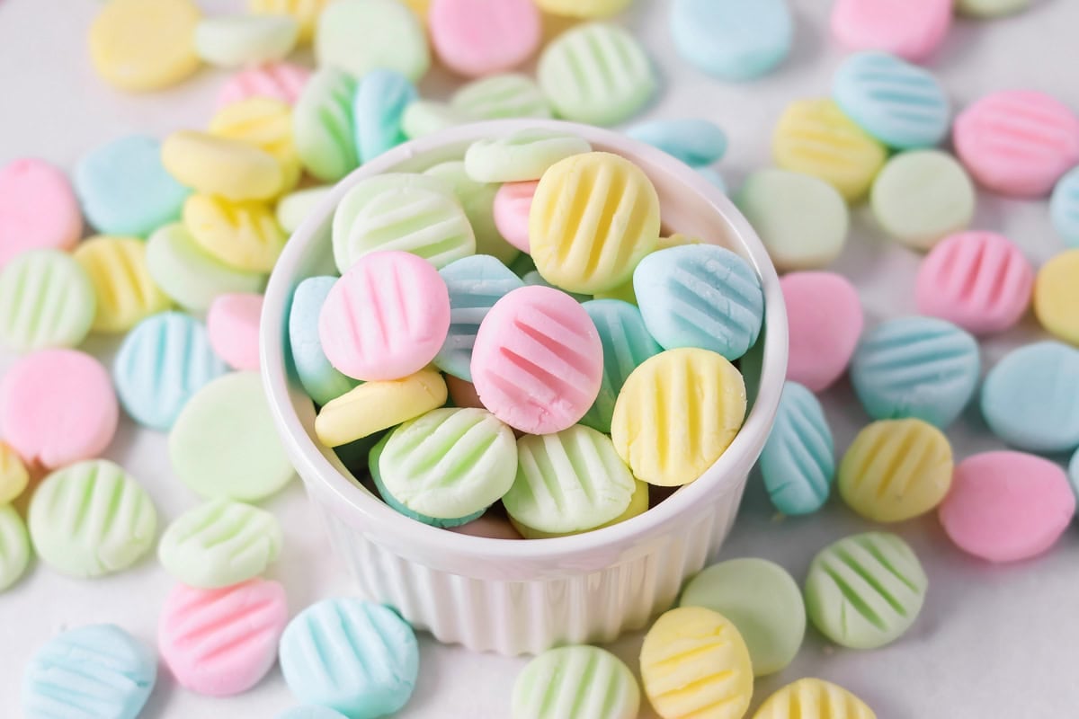 Cream cheese mints recipe in pastel colors in bowl.