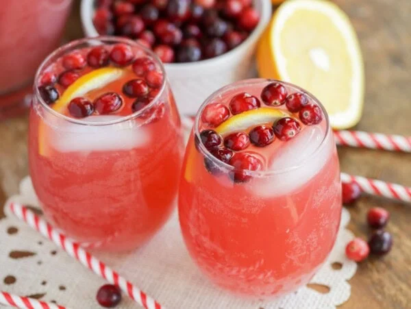 Holiday punch in two glass cups on table.