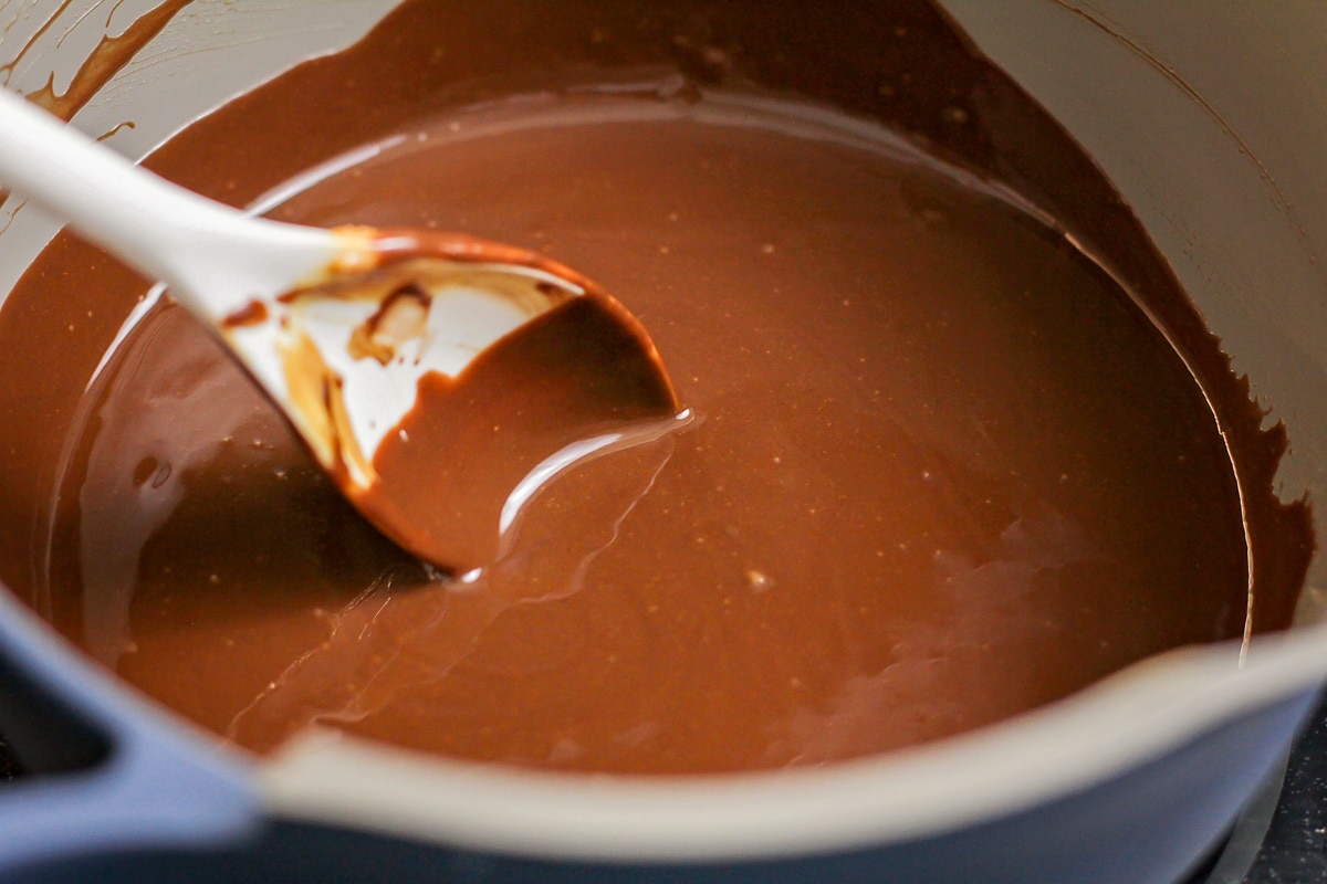 Chocolate melted in a grey bowl.