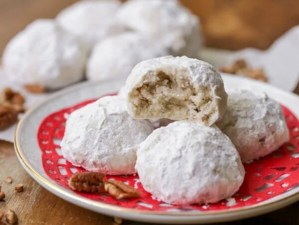 Snowball cookies on a plate.