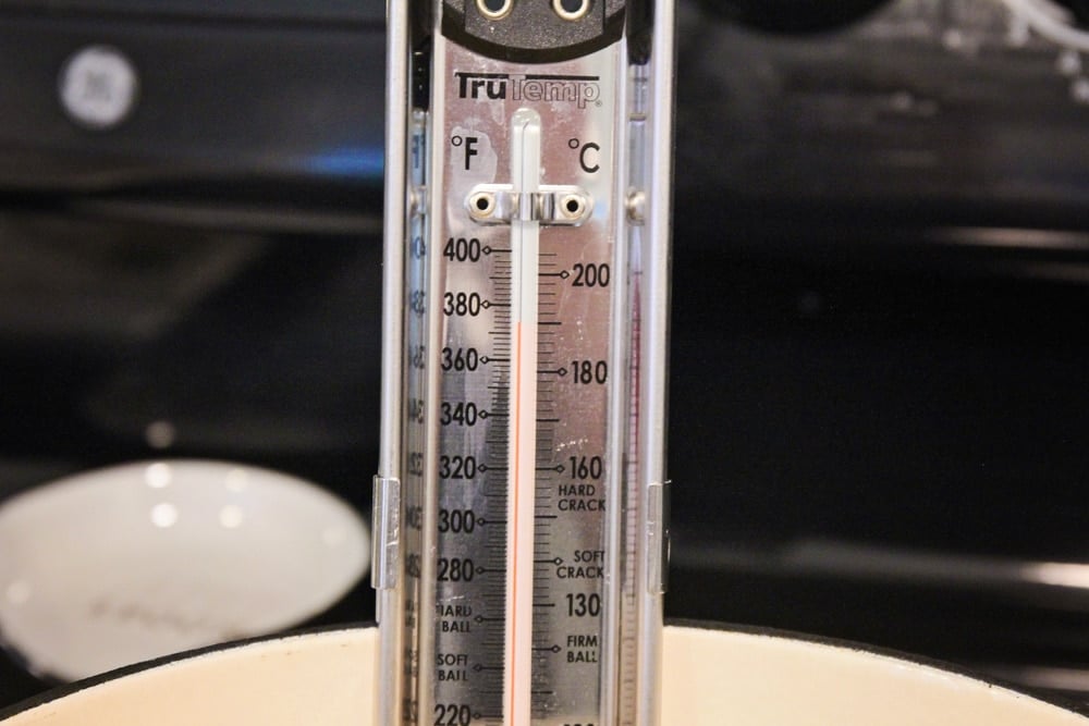 Candy thermometer in a pot of oil.