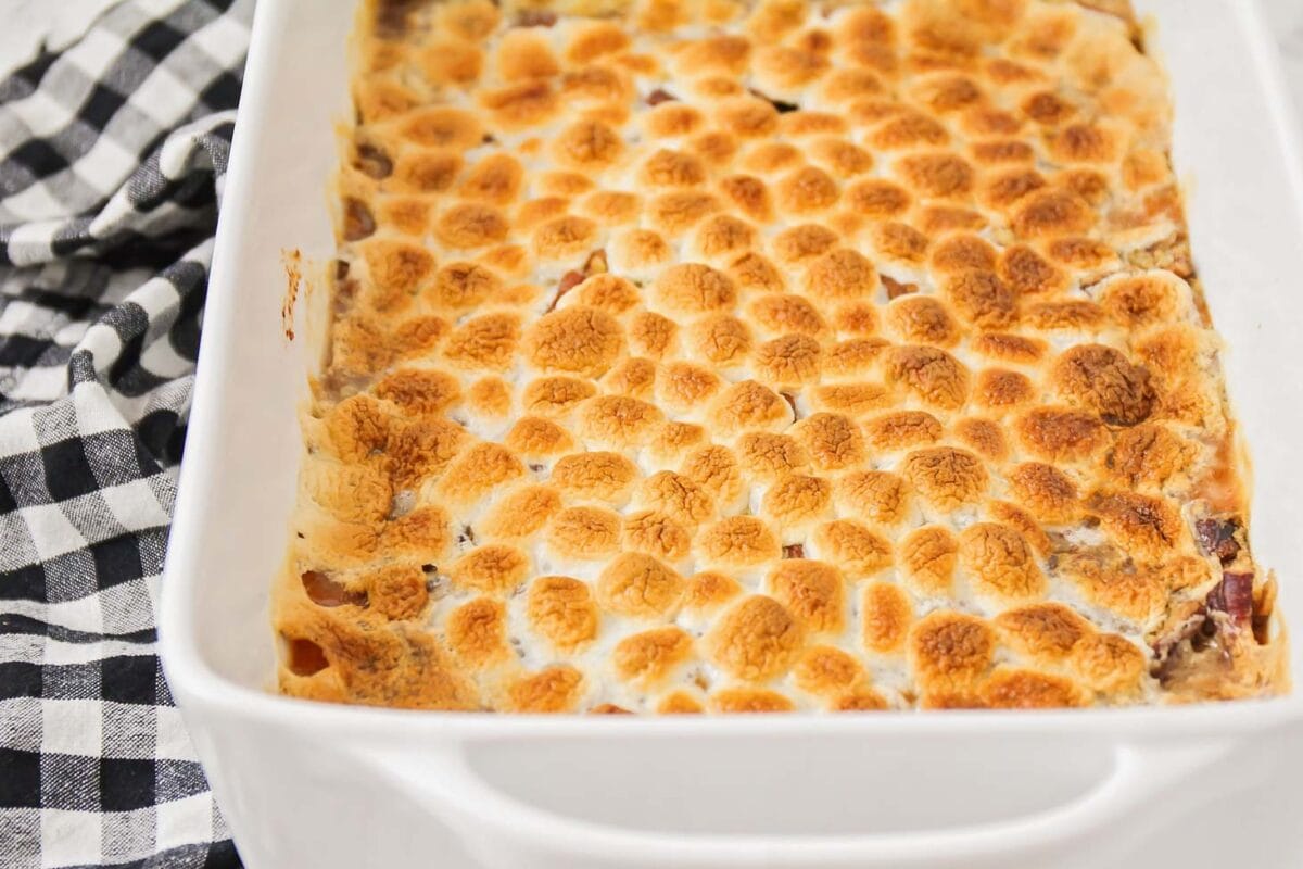Close up image of sweet potato casserole with marshmallows on top.