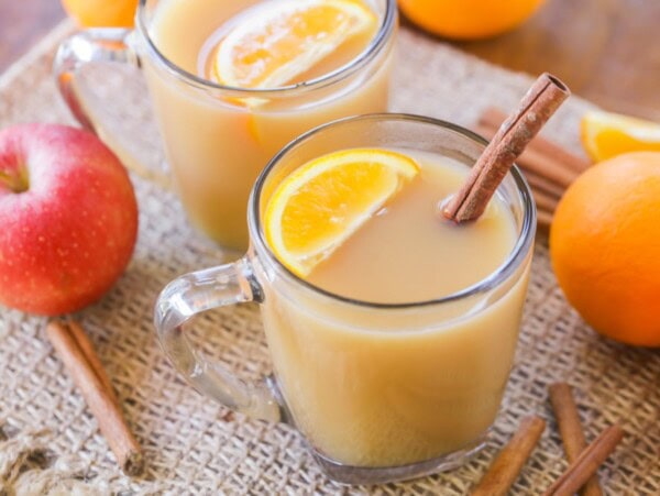 Homemade wassail recipe in a glass mug.