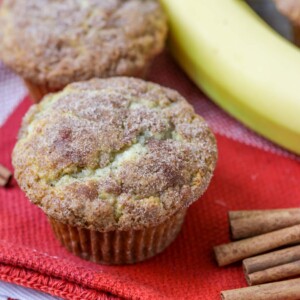 Homemade banana muffins on a tea towel.