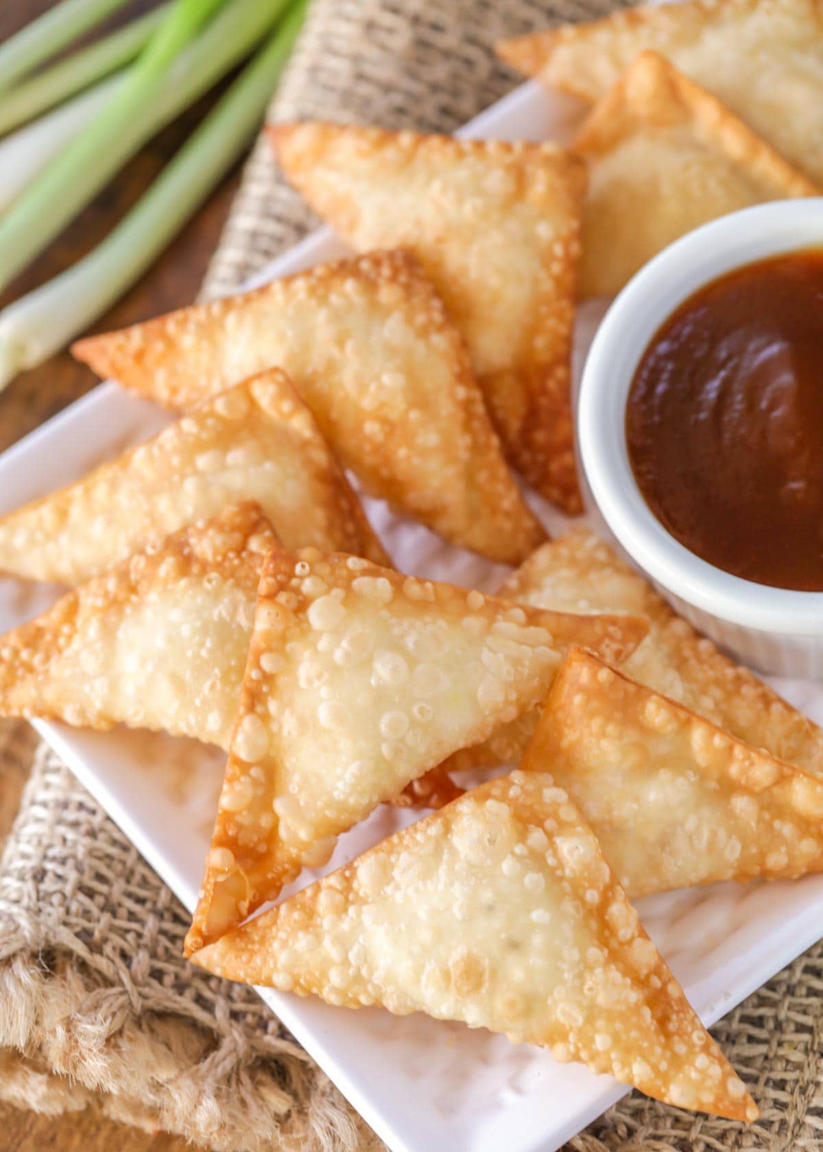 Cream cheese wontons recipe fried, on a white plate.