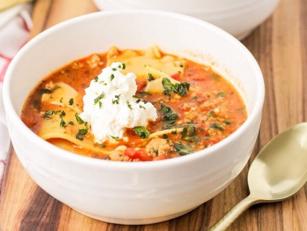 Lasagna soup served in a white bowl.