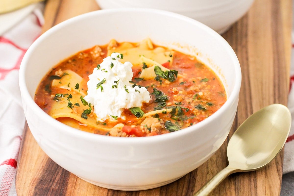 Lasagna soup served in white bowl.