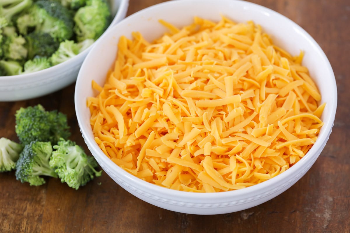 A bowl filled with shredded cheese.