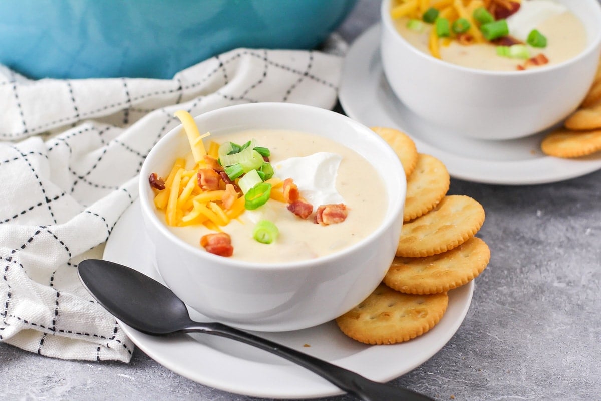 White bowl filled with creamy baked potato soup.