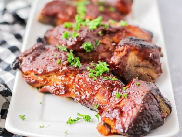 Our country ribs recipe topped with fresh herbs.