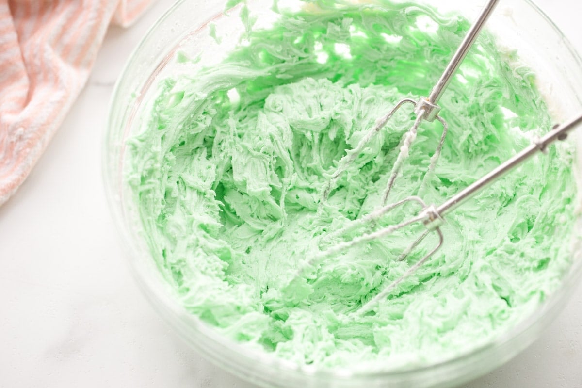 Green frosting in glass bowl.