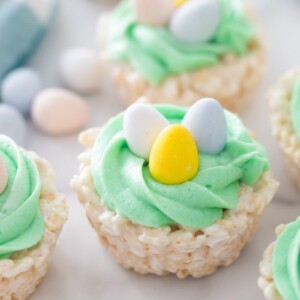 Easter rice krispie treats close up image on counter with more treats and candies.