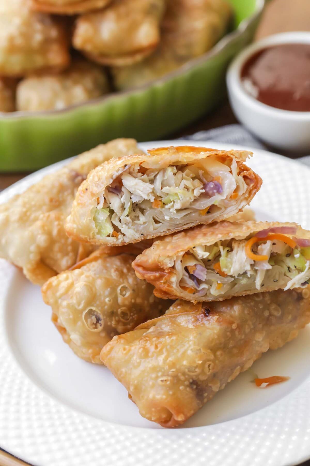 Fried Egg Roll recipe on a plate with one cut in half.
