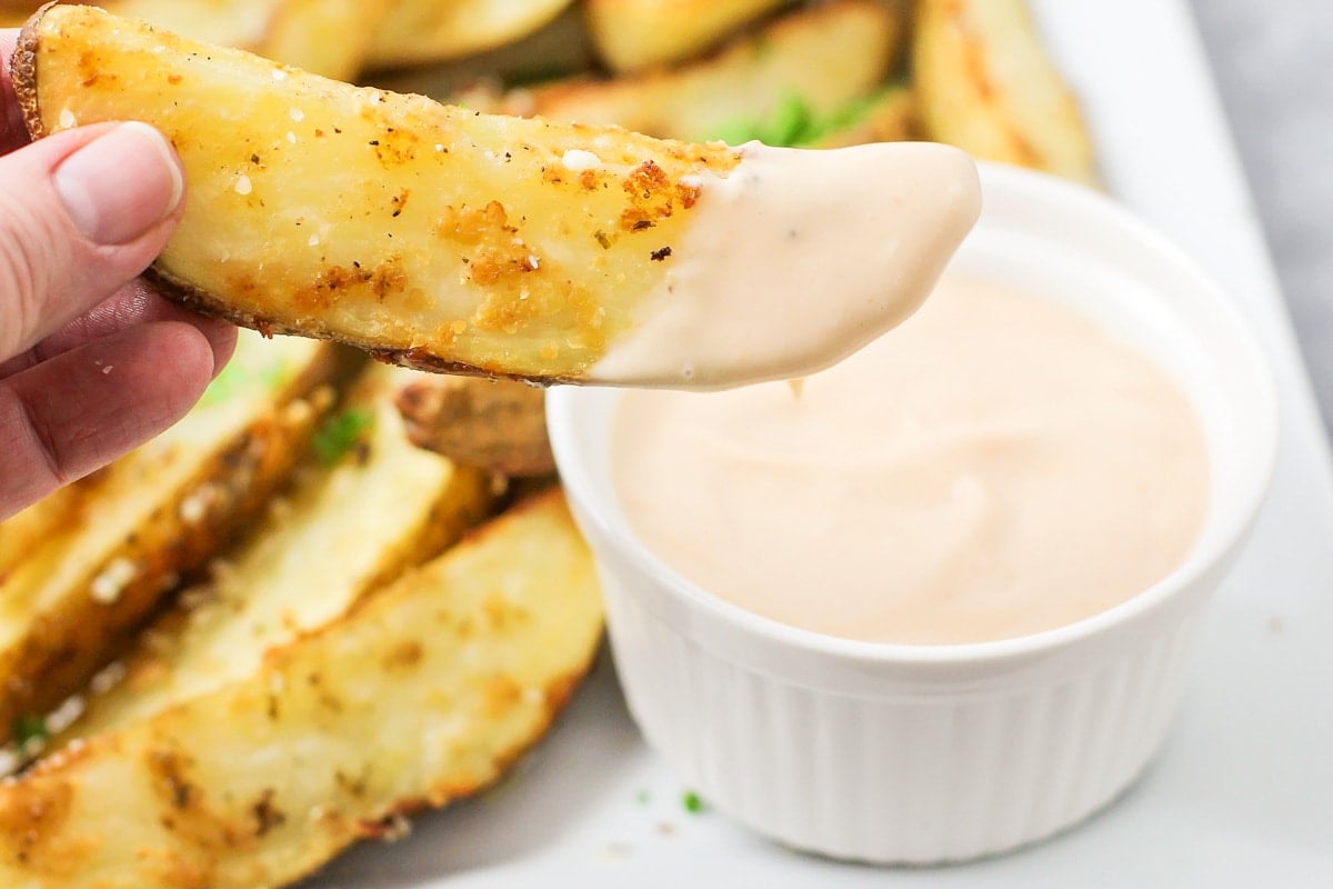 Dipping a homemade French fry into fry sauce.