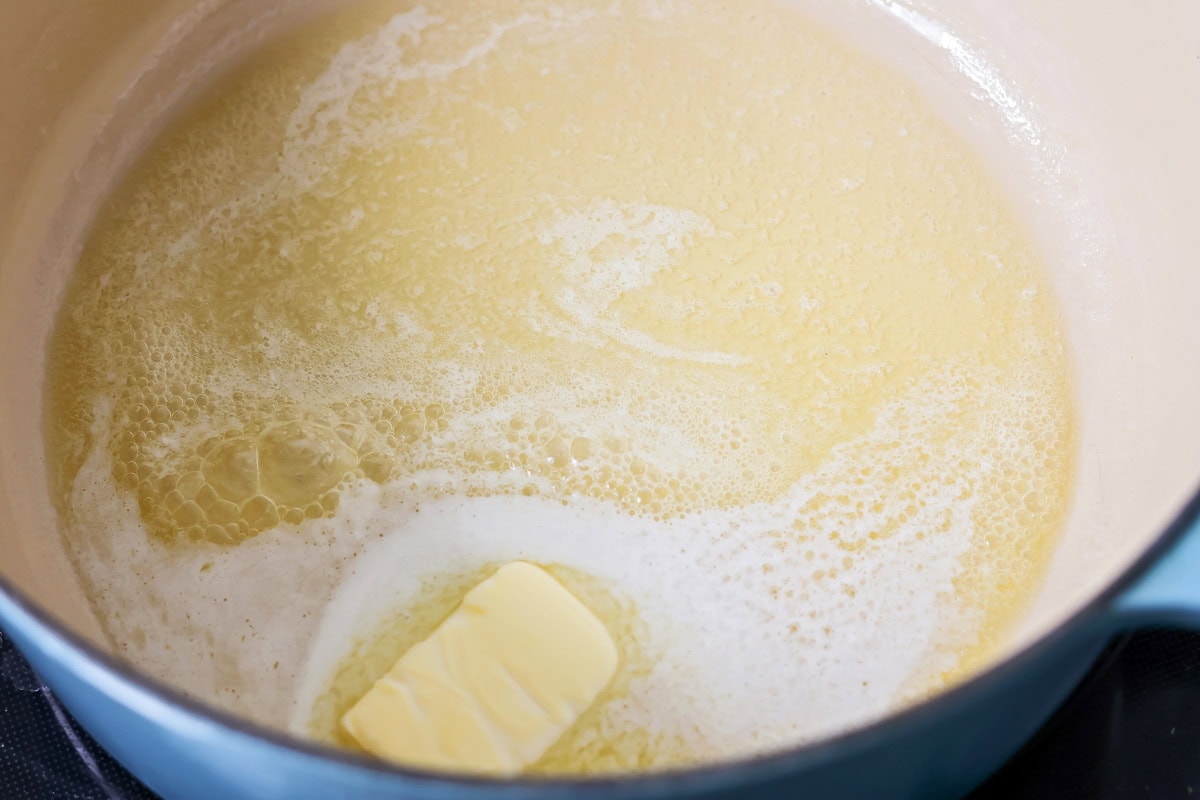 This flavorful Panera broccoli cheddar soup recipe tastes just like the original. Filled with hearty ingredients, it's sure to be a hit! Melting butter in a sauce pot.