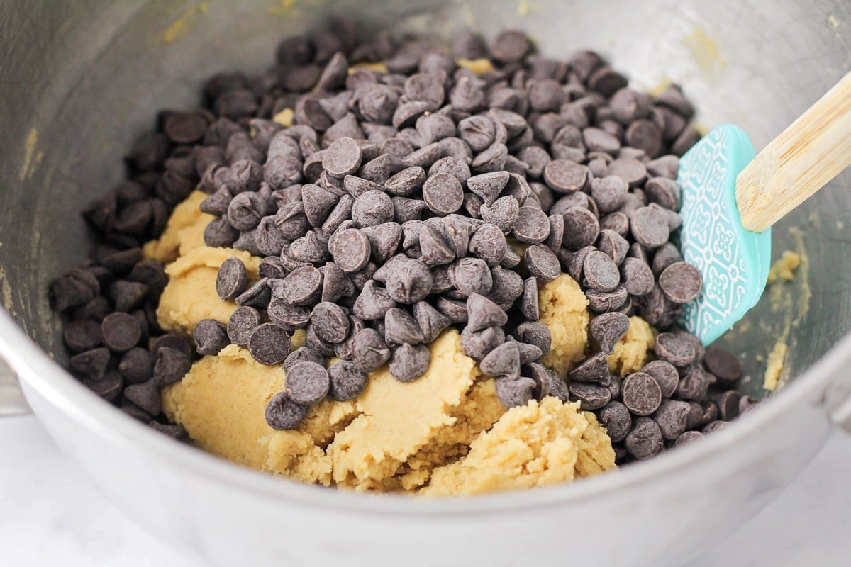 Chocolate chips on cookie dough.