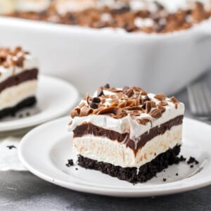 A slice of layered chocolate lasagna on a white plate.