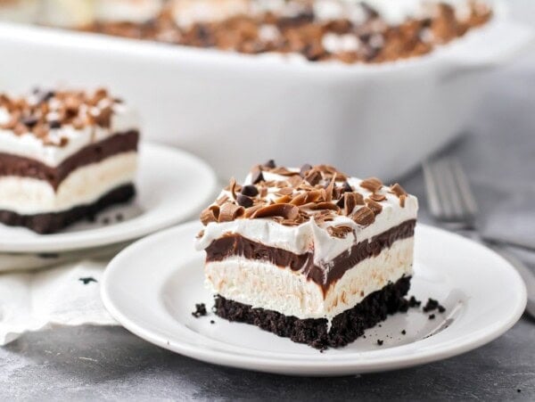 A slice of layered chocolate lasagna on a white plate.