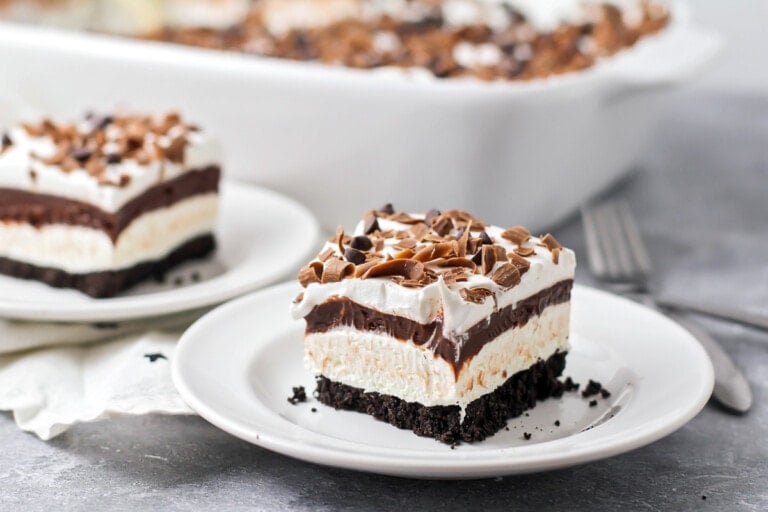 A slice of layered chocolate lasagna on a white plate.