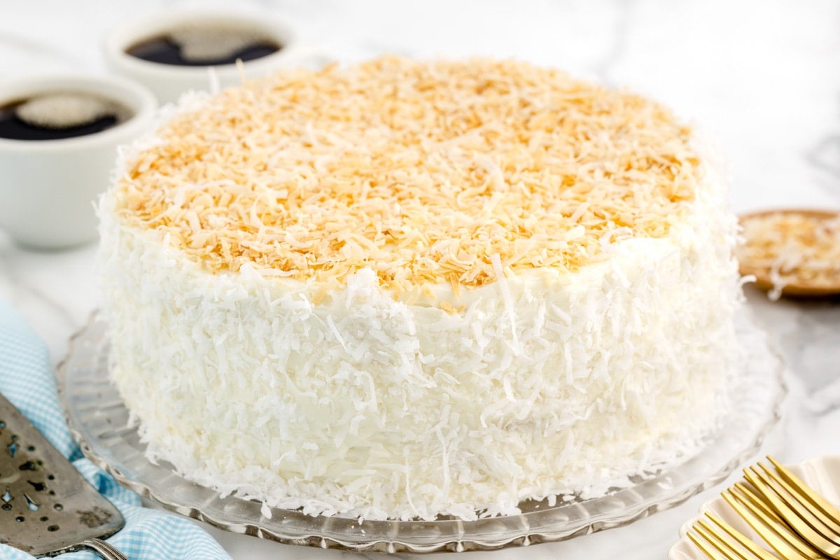 Best coconut cake recipe with coconut all over it.