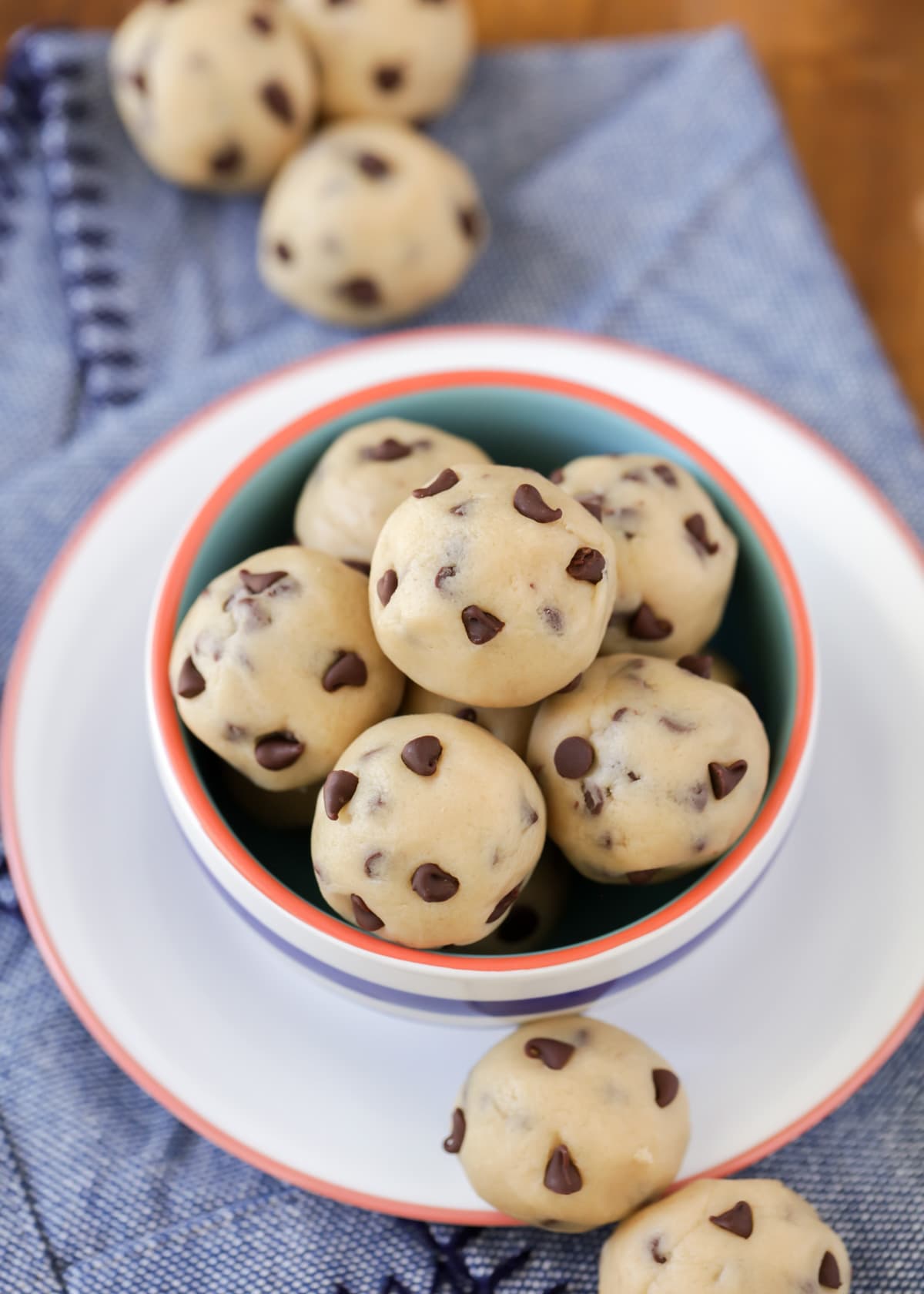 A bowl filled with chocolate chip cookie dough bites.