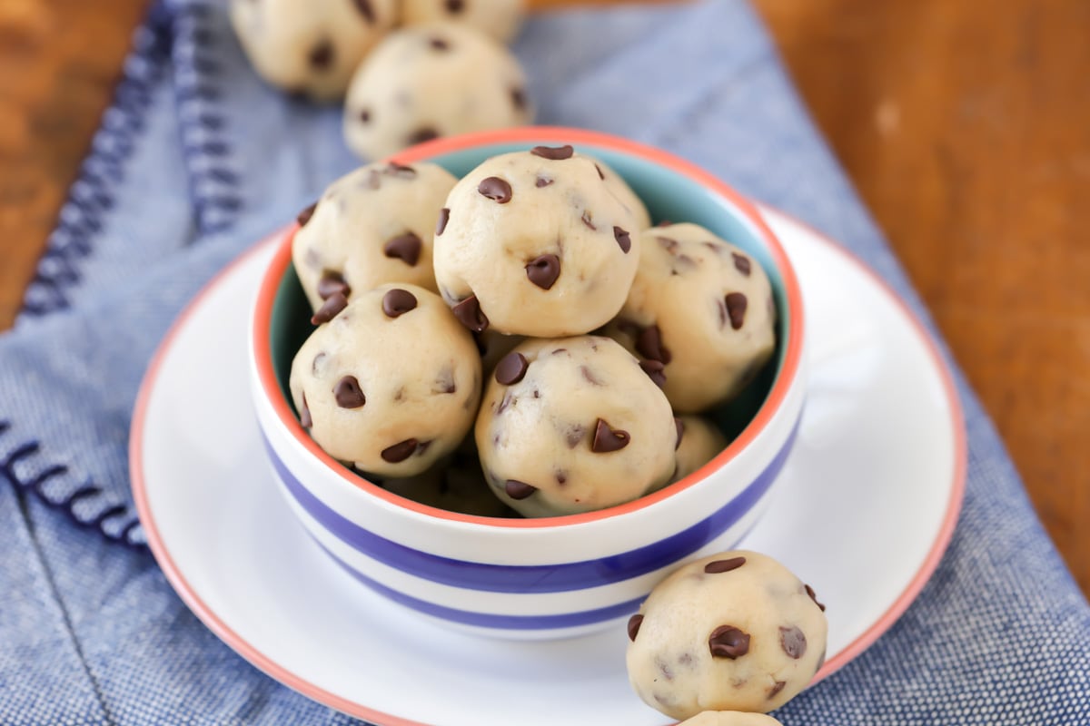 Cookie dough bites served in a blue and white bowl.