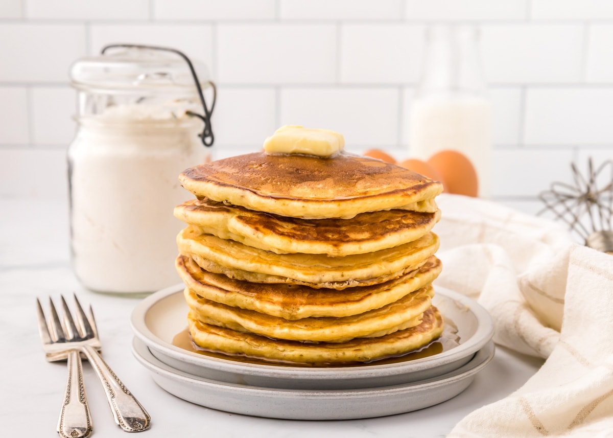 A stack of pancakes made with homemade pancake mix topped with a pad of butter.