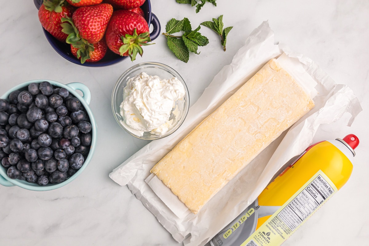 Puff pastry sheets with fresh berries and whipped cream.