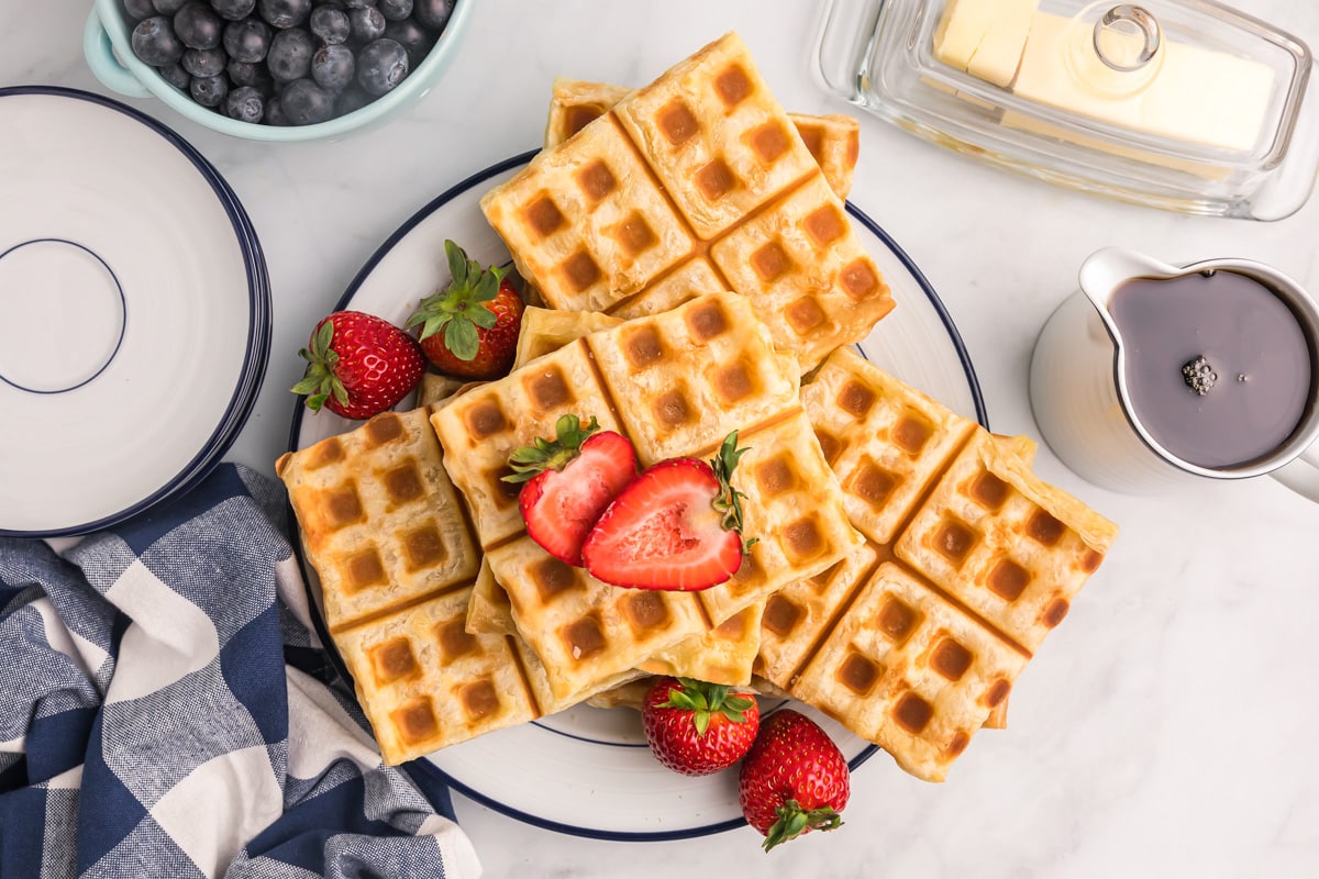 Flaky puff pastry waffles topped with fresh berries.